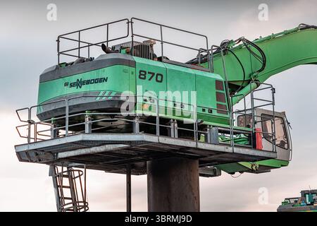 01 May 2025, Dikili, Turkiye: Heavy duty cycle crawler crane standing on metal platform on construction site, industrial machinery for heavy lifting Stock Photo