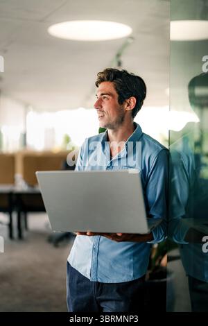 Software engineer using laptop computer with global network connection, Technology, innovation Stock Photo