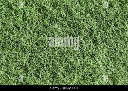 Green textured mesh surface. Macro of synthetic thread structure. Rough abrasive pattern. Detailed fiber grid. Closeup of tangled filament texture Stock Photo