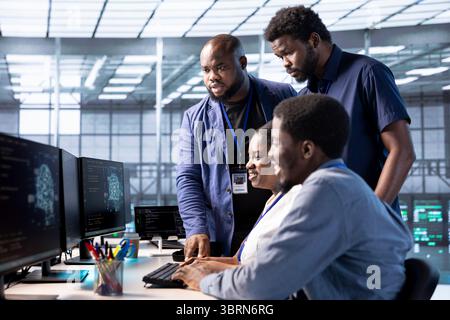 Cheerful team of server farm admins pleased after successfully finishing AI research, creating and implementing algorithms. Happy data center colleagues satisfied with work done on artificial intelligence Stock Photo