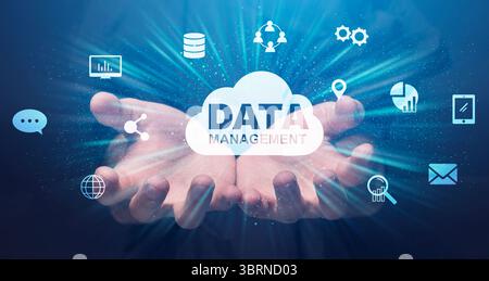 Data Management Conceptual Collage With Human Hands Holding Storage Cloud And Icons Stock Photo