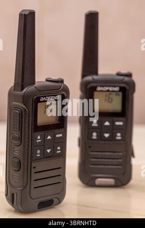 Two-Way Radios Close-up of a Baofeng Walkie-Talkie and Another in Background.London-UK Stock Photo