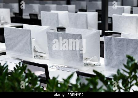Big office with covered computers with no workers Stock Photo