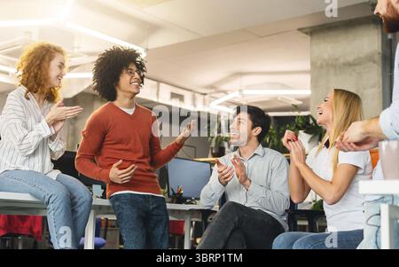 Creative team enjoying communication in modern office Stock Photo