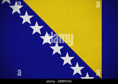 Flat design national flag is featuring blue field diagonal white stars and yellow triangle Stock Photo