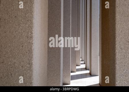 architectural detail of a building with columns, light and shadow patterns, abstract architecture monochrome background Stock Photo