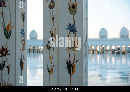 view of mosque interior with decorative columns, intricate floral patterns, marble inlay, Islamic floral pattern Stock Photo
