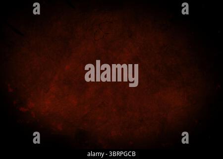 Dark red grunge texture is covering flat design canvas, showing black speckles and soft vignette Stock Photo