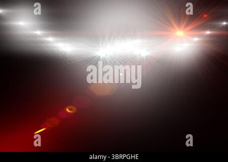 Cluster of white and orange lens flares is streaming across CGI dark field, with hexagonal bokeh Stock Photo