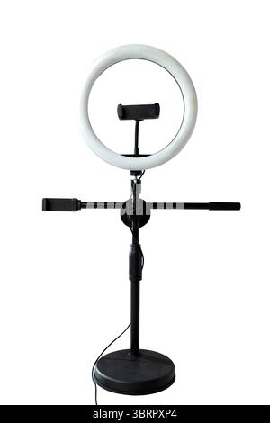 Round LED ring light with a phone holder isolated over a white background. Vlogging or live streaming equipment Stock Photo