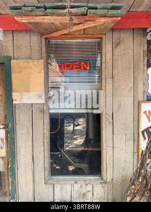 27 MAY 2025 - Austin, TX, USA - A classic OPEN sign on a traditional country bar in the USA Stock Photo