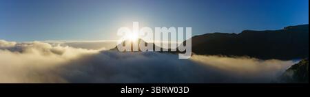 The sun rising behind Tryfan Stock Photo