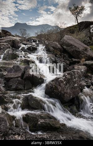 A waterfall flowing from Llyn Idwal in Eryri National Park Stock Photo
