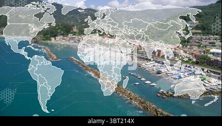 Displaying digital overlay mapping world map and hex grid over harbor, with boats and breakwaters Stock Photo