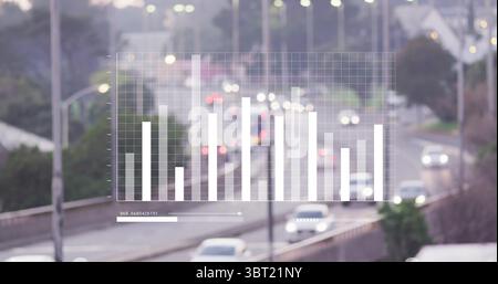 Displaying translucent bar chart overlay from elevated highway with cars, barriers and streetlights Stock Photo
