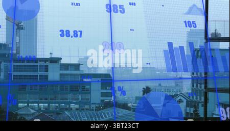 Displaying digital chart overlays on glass window overlooking commercial buildings in office Stock Photo