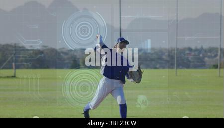 Throwing baseball player in blue white uniform on field, with baseball glove and data overlays Stock Photo