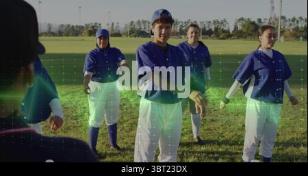 Stretching group of five women practicing drill on park field, with baseball jerseys and cleats Stock Photo