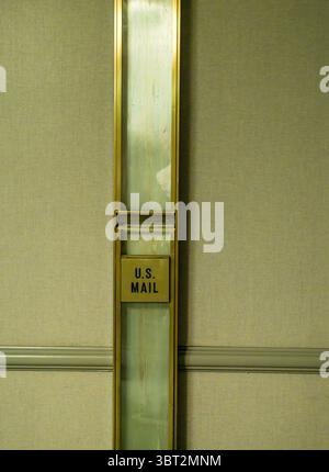 Vintage U.S. Mail slot on the wall of a historic hotel in San Antonio used to mail or post letters and postcards in the slot Stock Photo