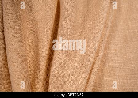 Beige linen fabric texture with soft folds minimal neutral background Stock Photo