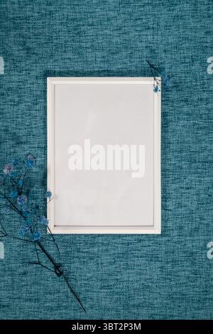 Beach themed composition with seashells and copy space on blue textured background Stock Photo