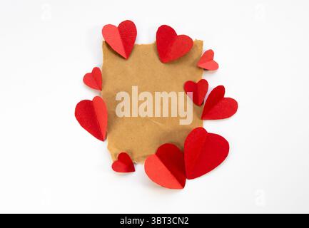 blank paper with red hearts border, torn piece of old paper, romantic love letter background Stock Photo