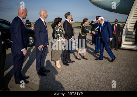 President Donald Trump is greeted by officials after his arrival at Amsterdam’s Schiphol Airport, Tuesday, June 24, 2025, ahead of the 2025 NATO Summit in The Hague, Netherlands. (Official White House Photo by Daniel Torok) Stock Photo