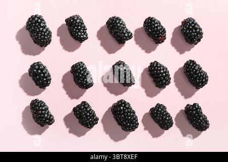 Fresh ripe blackberry on pink background, closeup Stock Photo