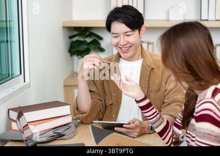 Back to School. Students collaborating on academic projects in a modern study space. Stock Photo