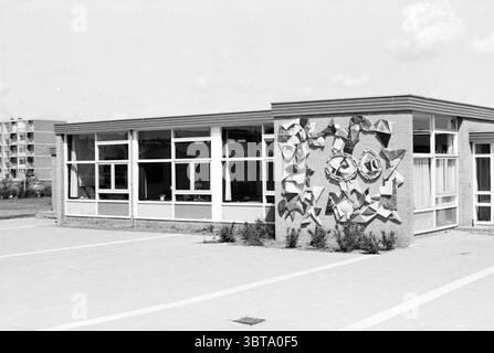 Reports N.Z.H. Schalkwijk Noord Zuid Hollandse Vervoersmaatschappij N.V. NZ, Whizgle News, Dutch Desk, The Netherlands, 1950 - 2000 on 05-07-1967. These topics are shown in the image. The scene captures a modern building characterized by its striking architectural design. The structure features a combination of large, rectangular windows framed in white, allowing ample natural light to illuminate the interior space. The walls are predominantly a soft beige or light tan, contrasting with the bold, artistic mural on the side, which showcases dynamic shapes and forms in various shades. The mural Stock Photo