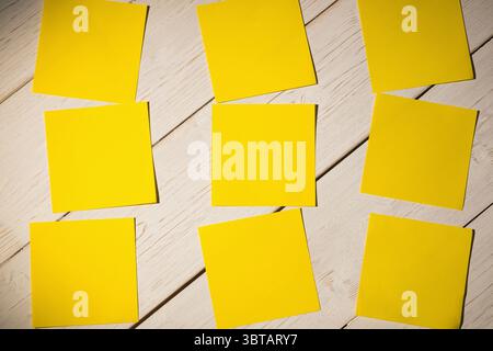 Yellow papers on wooden floor Stock Photo