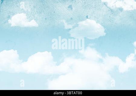 White fluffy cumulus clouds are drifting across pastel blue sky in painterly grunge style Stock Photo