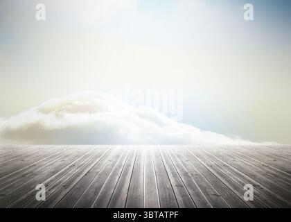 Displaying wooden deck planks receding toward horizon in flat design with billowy cloud bank Stock Photo