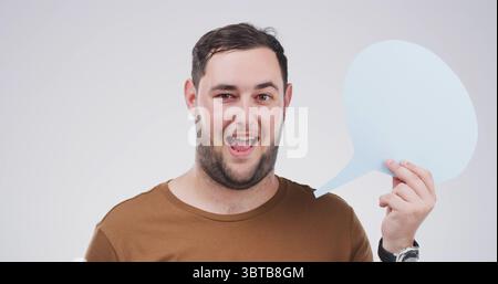 Portrait, social media and speech bubble with man in studio for communication, opinion or voice. Mockup space, omg and word balloon with shocked Stock Photo
