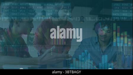Collaborating data analysts interpreting analytics in modern office with laptop papers coffee mugs Stock Photo