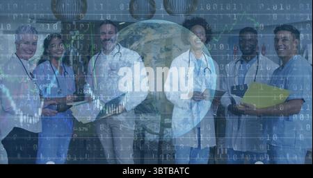 Standing medical team wearing uniforms in meeting room, with clipboards, tablet and stethoscopes Stock Photo