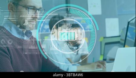 Typing senior data engineer working on laptop at tech workspace, with holographic data overlay Stock Photo