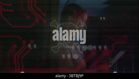 Standing IT specialist in tech center with tablet, headset, skull icon and circuit traces Stock Photo