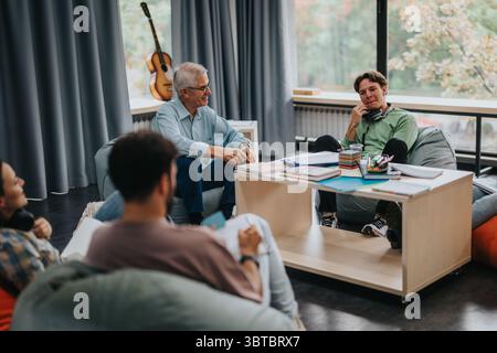 Professor engaging with students in a comfortable study environment Stock Photo