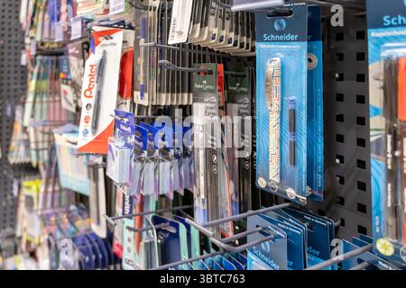 Poznan, Poland - June 30, 2025: Close-up view of various new writing tools and art supplies, like fountain pens, available for purchase in a well-stoc Stock Photo