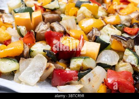Roasted vegetables isolated on white background Stock Photo