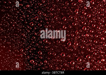 Abstract photography with water drops with reflections on red, close-up background, macro photography Stock Photo