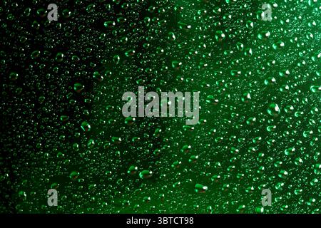 Abstract photography with water drops with reflections on green, close-up background, macro photography Stock Photo