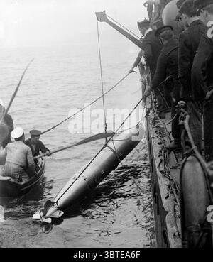 Royal Navy sailors with a torpedo Stock Photo - Alamy