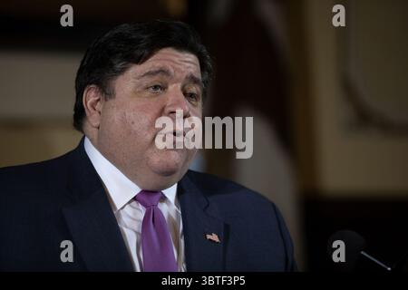 Illinois Gov. JB Pritzker speaks during a press conference Tuesday ...
