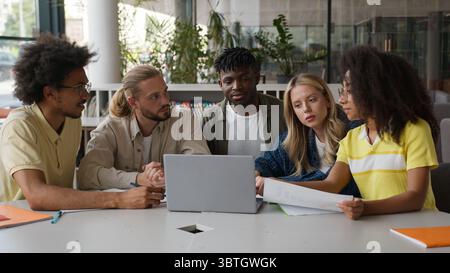 Group of multiracial diversity students e-learning together studying in high school pupils gathering men women girls guys in college university with Stock Photo
