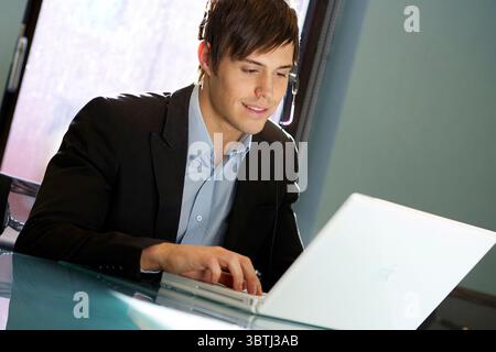 Businessman using headset at work Stock Photo