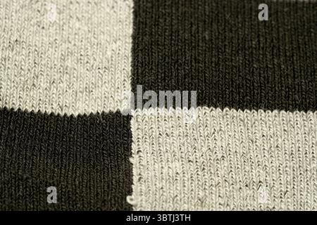 Close-up of a unique black and white checkered textile showcasing intricate detail. Stock Photo