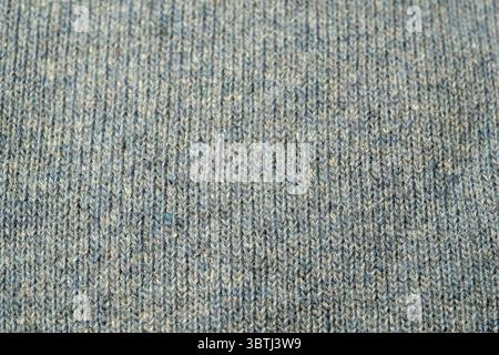 Close-up view of textured gray knit fabric ideal for clothing and accessories. Stock Photo