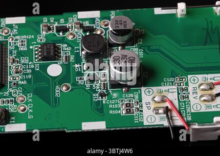 Digital electronic circuit board of the device with chips and other details close-up macro photography Stock Photo